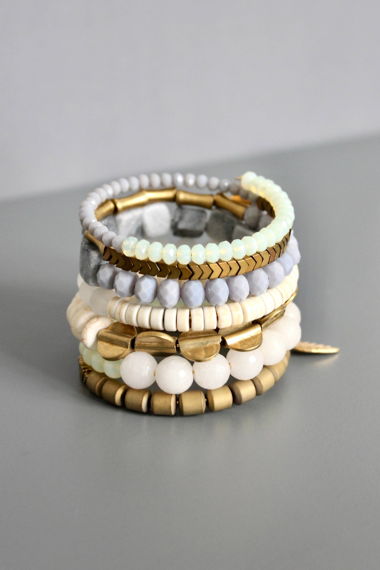 Gray, white, and brass wrap bracelet