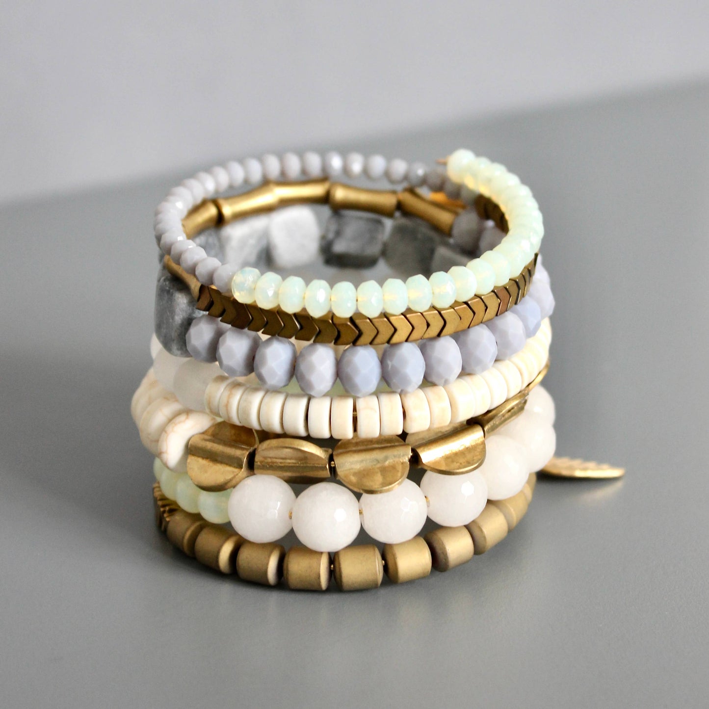 Gray, white, and brass wrap bracelet