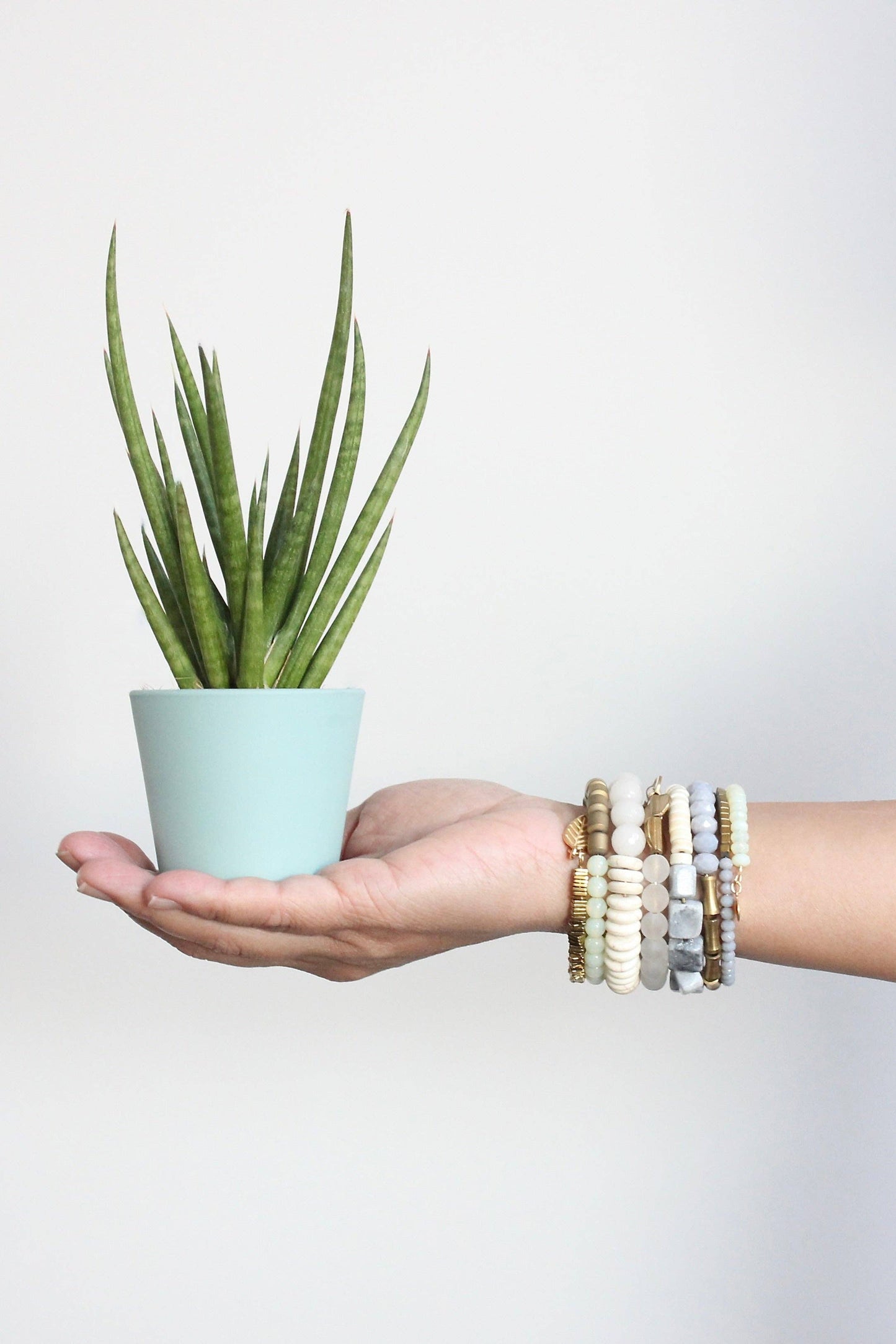 Gray, white, and brass wrap bracelet