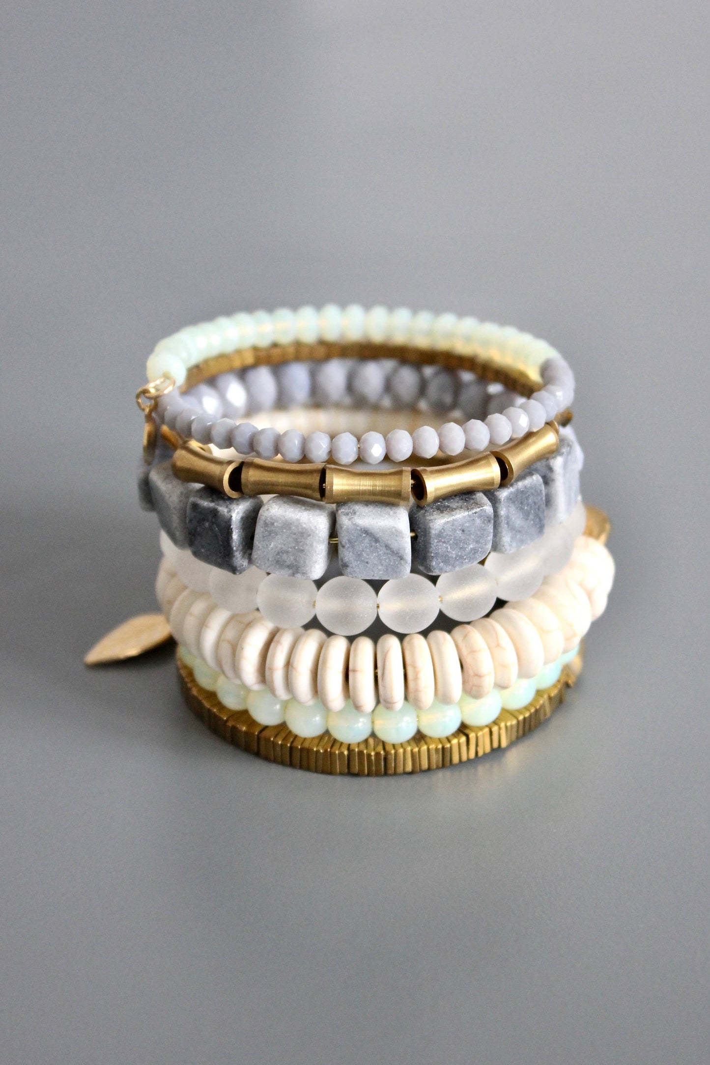 Gray, white, and brass wrap bracelet
